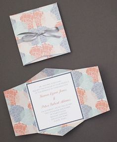 the wedding stationery is laid out on top of each other, with an elegant bow