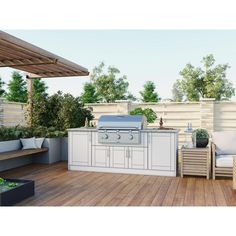 an outdoor kitchen with grill and seating area