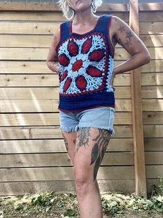 Holy crap this is amazing and special  1970's handmade crocheted tank top  Blue, light blue and red colors  Great pattern and design  Tank sleeves and scoop down pretty low so your bra will definitely hang out  That doesn't bother me but it may to some so it's to be noted  It's in amazing condition  Fits a medium/smaller large there is a little stretch to the yarn  Measurements are approximate and taken flat so please double bust and waist for more accurate sizing  Bust: 17.5 in  Waist: 16 in  L Handmade Blue Tops For Festival, Handmade Blue Cotton Crochet Top, Summer Tank Tops With Patchwork, Blue Cotton Crochet Top For Festival, Handmade Sleeveless Tank Top For Beach, Bohemian Patchwork Tank Top For Summer, Fitted Crochet Tank Top In Bohemian Style, Fitted Crochet Bohemian Tank Top, Sleeveless Granny Square Tops For Spring