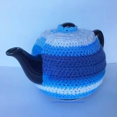 a crocheted blue and white tea pot cover