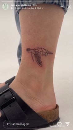 a small turtle tattoo on the ankle