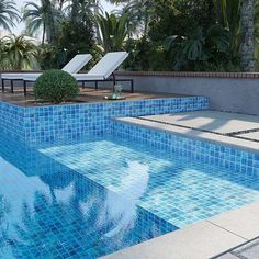 an empty swimming pool with lounge chairs and palm trees in the backgrouds