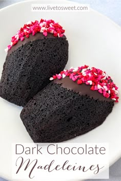 two pieces of chocolate cake with sprinkles on top and the words dark chocolate madeleine