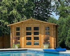 a pool with a wooden shed next to it