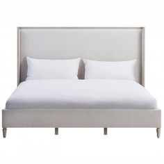 a bed with white sheets and pillows on it's headboard, against a white background