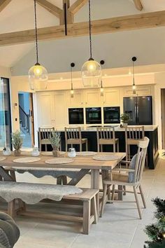 a kitchen and dining room with an open floor plan