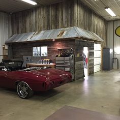 an old car is parked in a garage