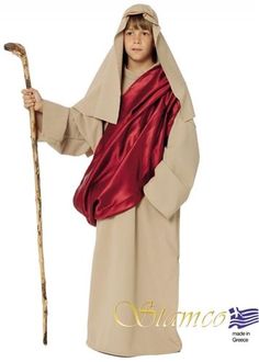 a young boy dressed as jesus holding a stick