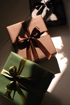 two wrapped presents sitting on top of each other