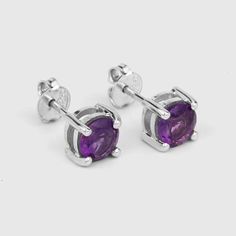 Amethyst Stud Earrings / Natural Amethyst Round Stud Earrings / February Birthstone EarringsFlaunt yourself with these amethyst stud earrings. The natural gemstones have a combined weight of 1.53  carats and are set in .925 sterling silver with rhodium plating. The purple hue of these earrings adds a pop of color to any look!  The understated design and vibrant stones make these perfect for every occasion.amethyst earrings, amethyst silver earrings, amethyst stud earrings, natural amethyst silve Amethyst Earrings For Gift, Purple Round Pierced Earrings, Amethyst Birthstone Earrings For Gift, Amethyst Birthstone Earrings As A Gift, Round Amethyst Gemstone Earrings, Purple Amethyst Birthstone Earrings, Nickel-free Round Purple Earrings, Purple Birthstone Drop Earrings, Silver Amethyst Birthstone Earrings