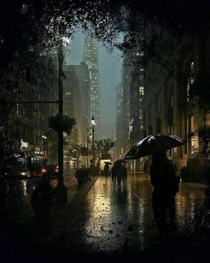 people walking in the rain with umbrellas on a city street at night, near tall buildings