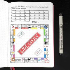 an open notebook with a monopoly game on it