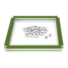 a game board with dices and pieces in it on a white surface, top view