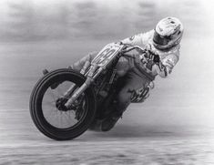 a man riding on the back of a motorcycle