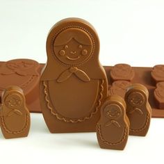 a group of chocolate molds sitting on top of each other