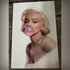 a painting of marilyn monroe blowing a bubble