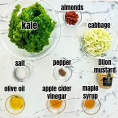 the ingredients to make kale salad laid out on a marble counter top with names