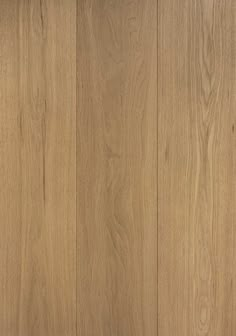 a close up view of the wood grains on this flooring project, with light brown tones