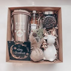 an open box containing coffee, tea and other items for christmas or new year's eve