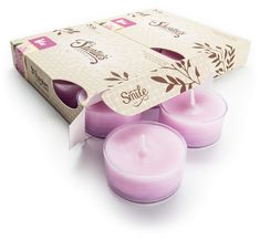 three small candles in a box with the lid open