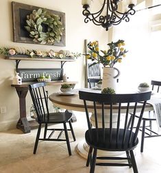 a dining room table with four chairs around it