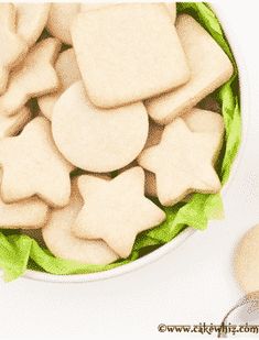 a bowl filled with cut out cookies and lettuce