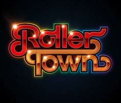 the roller town logo is shown on a dark background, with bright lights coming from it