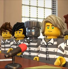 the lego movie characters are sitting at a table with microphones in front of them