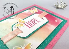 a close up of a card with a butterfly on it and the word hope written in pink