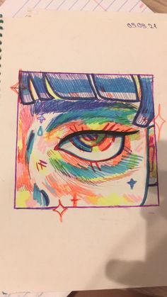 an eye drawn in colored pencils on top of a piece of paper with writing underneath it