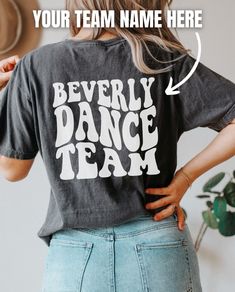 the back of a woman's t - shirt that says, beverly dance team