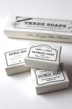 three bar soaps sitting next to each other on top of a white countertop