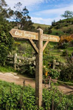 a wooden sign pointing in opposite directions to each other