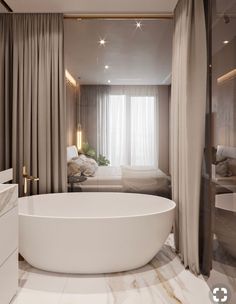 a large white bath tub sitting in the middle of a bathroom