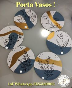 four plates with designs on them sitting on top of a white table next to the words porta vaso?