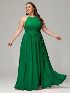 a woman in a long green dress