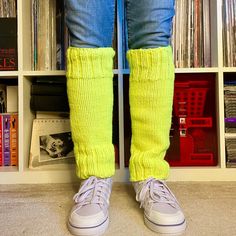 "Keep your legs warm this winter with these neon yellow pair of leg warmers. They are super bright and soft.  Leg warmers measure about 17-18\" in length and almost 6\" wide. The model has a calf circumference of about 14.5\".  These stretch and should fit most adult ladies legs. 100% acrylic yarn. Machine washable. Low iron. Do not bleach. Dry flat. All are handmade in the USA. If you have any questions about the sizing and fit, please message me. If the item received is damaged, please contact Trendy Yellow Winter Socks, Trendy Yellow Socks, Fitted Green Knee-high Socks For Winter, Green Stretch Leg Warmers Casual Style, Casual Fitted Hand Knitted Socks, Casual Hand Knitted Fitted Socks, Casual Hand-knitted Fitted Socks, Hand Knitted Fitted Casual Socks, Casual Stretch Hand Knitted Leg Warmers