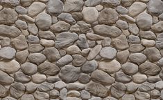 a stone wall with several rocks on it