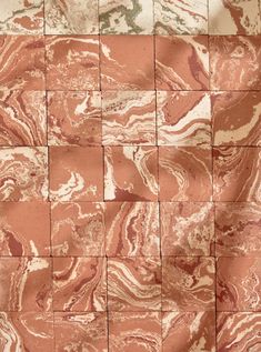 an orange and white marble tile wall