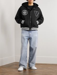 Valentino's jacket takes cues from classic varsity styles. It's made from soft cotton-jersey detailed with tactile appliquéd emblems to evoke a sporting spirit. The convertible hood gives you two ways to wear it. Cotton Varsity Hoodie Outerwear, Luxury Cotton Varsity Jacket, Varsity Cotton Hoodie Outerwear, Black Hooded Collegiate Varsity Jacket, Valentino Jacket Man, Valentino Jacket, Valentino Logo, Jacket For Men, Black Logo