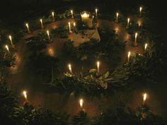 many candles are lit in the shape of a circle