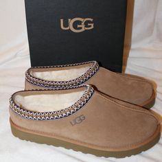 The Outsole Of This Product Is Either A Sugarsole Outsole, Which Is A Responsible Compound Using Sugarcane Foam That Allows Us To Reduce Dependency On Fossil Fuels By Replacing Petroleum-Based Ethylene, Or A Treadlite By Ugg Outsole. Treadlite By Ugg Proprietary Compound Which Increases Cushioning And Traction For A Supremely Lightweight, Ultra-Durable Sole. Sheepskin Lining Vetted Through Extensive, Industry-Leading Processes To Ensure Only The Highest Quality Sheepskin Makes The Cut, Delivering The Signature Feeling Of Ugg. Suede Upper Uggbraid Made With 100% Recycled Polyester Fibers 17mm Sheepskin Or 17mm Uggplush 60% Upcycled Wool, 40% Tencel Lyocell Lining 17mm Uggplush 80% Upcycled W Grey Ugg Slippers, Pink Ugg Slippers, Vans Shoes Fashion, Cute Uggs, Slip On Slippers, Ugg Tasman Slippers, Ugg Tasman, Shoes Outfit Fashion, Fossil Fuels