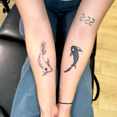 two people with matching tattoos on their arms