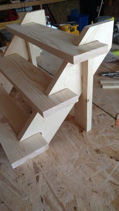 a table made out of wood sitting on top of a hard wood floor in a room