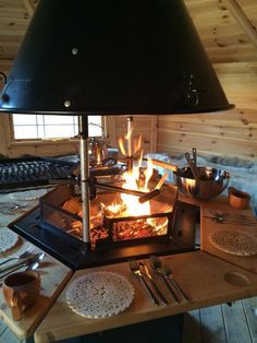 a stove that has some food on it and is lit by the light of a lamp