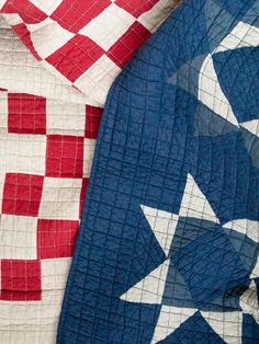 two red, white and blue quilts laying next to each other