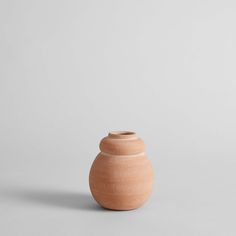 a small vase sitting on top of a table