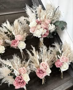 flowers and feathers are arranged on the stairs