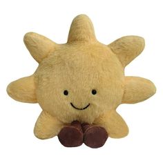 a yellow stuffed starfish with brown feet and eyes, sitting on a white background