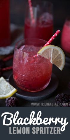 two glasses filled with raspberry lemonade and garnished with strawberries